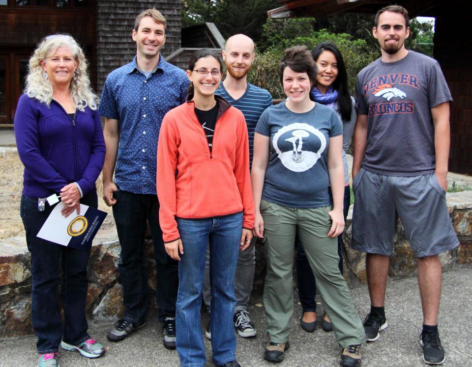 Chair of PMB, N. Louise Glass, with Poster Prize Winners: (1st) Rose Kantor, (2nd) Mike Steinwand, (Honorable Mentions) Cat Adams, Justin Zik, Elias Cornejo-Warner and Kulika Chomvong